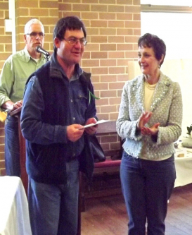 Stephen Utick receives donations from the Highlands Garden Club 